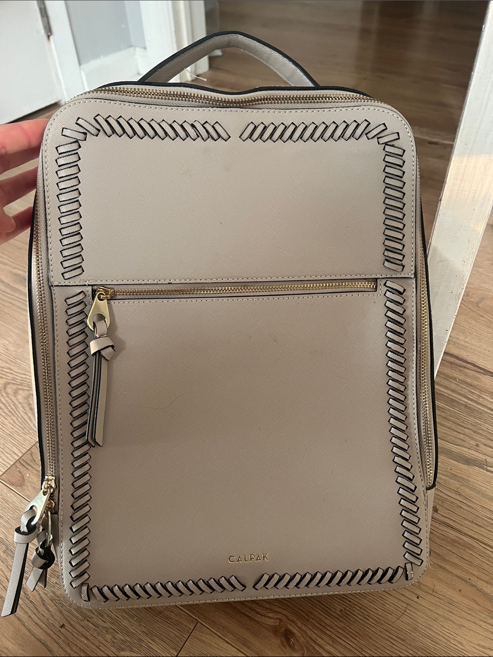 Calpak taupe beige women's backpack with woven-edge detail